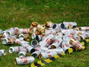 Discarded cans on the grass.